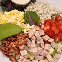 Classic Cobb Salad · Fresh grilled chicken breast, avocado, blue cheese crumbles, smoked bacon, tomatoes, egg and...