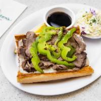 Italian Beef Sandwich · A Chicago staple! Savory beef piled high on garlic bread with melted mozzarella, sauteed gre...