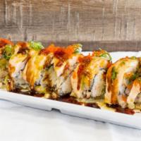 Baked Salmon Roll · In: Avocado, crabmeat
Out: Baked, salmon, spicy mayo, green sauce
Sauce: eel sauce