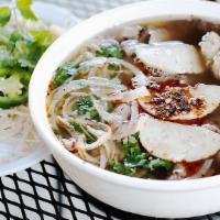 Bún Bò Hue · Spicy hue style lemon grass soup with beef, pork roll and vermicelli.