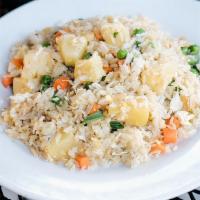 Vegan Pineapple Fried Rice · Tofu, pineapple, carrots, peas and onions.