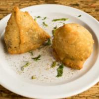 Samosas · Crispy pastries filled with potatoes and peas. served with our traditional tamarind and mint...