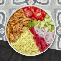 Chicken Shawarma Bowl · Tender chicken shawarma over rice. Served with our cucumber and tomato salad, leafy greens, ...