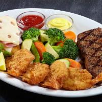 Classic Trio · 6 oz. ranch cut steak, 4 giant shrimp and our signature malibu chicken. Served with any choi...