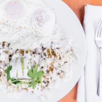 Chilaquiles · Tortilla chips sauteed with fresh tomatillo salsa, roasted pork, queso fresco, crema, and av...