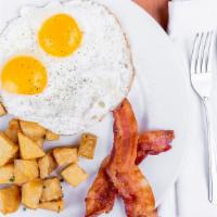 2 Eggs Combo · Two eggs served any style with fries and choice of bacon or sausage. Served with one small p...