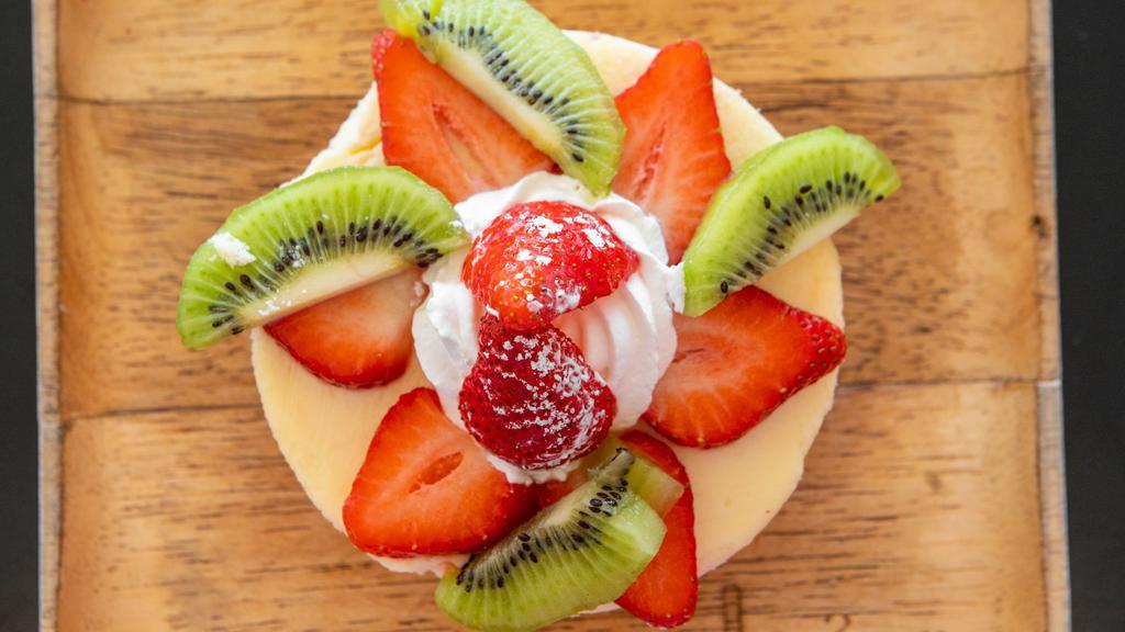 New York Cheesecake · New York style cheesecake comes with Strawberry sauce, whipped cream, powder sugar and a scoop of Ice Cream.      Add additional items from our Cream Sauce, Dry Toppings and Fruits