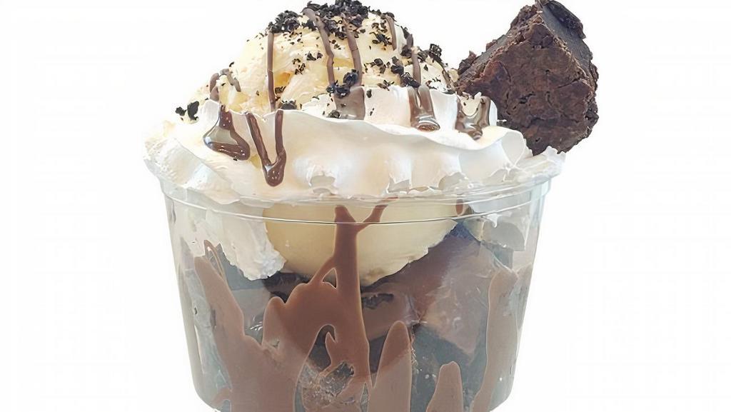 Brownies Ice Cream Cup · warm chocolate brownie bites served with a scoop of ice-cream, topped with whipped cream and your choice of topping
