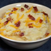 Loaded Mashers · Comfort food at its best--mashed potatoes topped with cheddar cheese and BOSS. bacon.