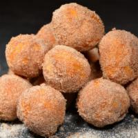 Fried Donut Holes (5) · Fried dough tossed in cinnamon and sugar served with an indulgent chocolate dipping sauce. I...