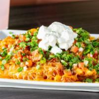 Irish Nachos · Waffle fries with jack and cheddar blend, bacon, green onion, pico de gallo and sour cream