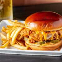 Fried Chicken Sandwich · Breaded chicken breast tossed in Cajun seasoning. Pickles, Swiss, and chipotle ranch. Served...