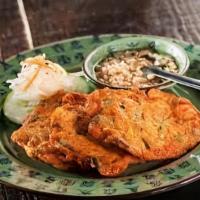 Tod Man Pla (Fish Cake) · Fish cake patties seasoned with curry paste and green beans, deep-fried, and served with cuc...