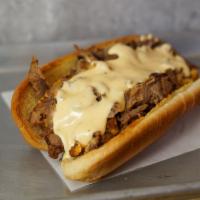 Classic Philly Cheesesteak · Classic 8” Philly cheesesteak loaded with grilled steak and melted cheese on a toasted hoagi...