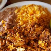 Homemade Chorizo Con Huevos · Homemade Mexican style pork sausage scrambled with eggs. Served with beans, rice, and tortil...