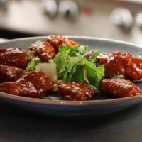Buffalo Chicken Wings · One pound of  crispy chicken wings, tossed in our fiery buffalo sauce. Served with bleu chee...