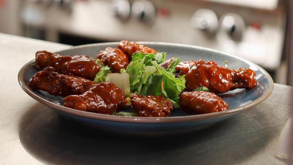 Buffalo Chicken Wings · One pound of  crispy chicken wings, tossed in our fiery buffalo sauce. Served with bleu cheese dressing, celery and carrot sticks.