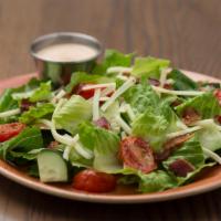 House Chop Salad · Romaine blend, bacon, cucumber, roasted tomatoes, White Cheddar cheese, BBQ onion ranch dres...