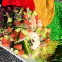 Ceviche · Spicy citrus-marinated shrimp, serrano chili, red onions, pico de gallo, avocado, cucumber.