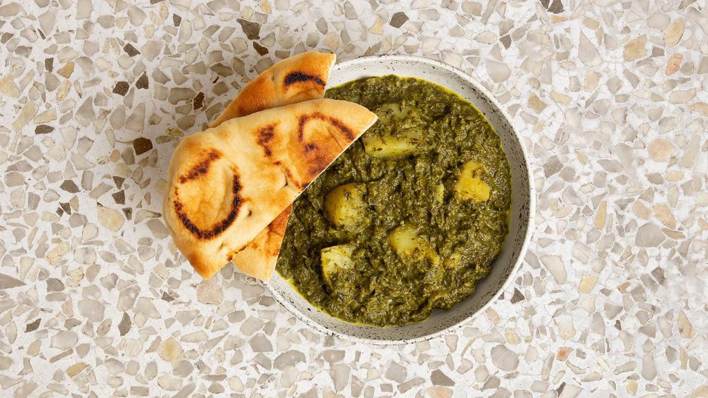 Saag Aloo · Fresh chopped spinach and potatoes cooked with special herbs and spices.