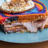 Rainbow Melt Apocalypse · Rainbow bread, cheese, ham, fried egg, side of mayo.