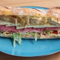Milano Sandwich · Baguette bread, hard salami, artichoke heart, Manchego cheese, lettuce, tomatoes, thousand i...