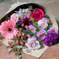 All Pink Bouquet  · A variety of pink flowers that include roses, daises, pink wax and more! wrapped in brown pa...