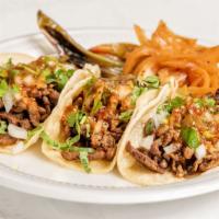 Street Taco Regular · Choice of meat, onion, cilantro, salsa.
