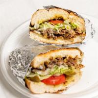 Torta Sandwich · Choice of meat, tomatoes, onions, lettuce, guacamole, jalapeños, and sour cream.