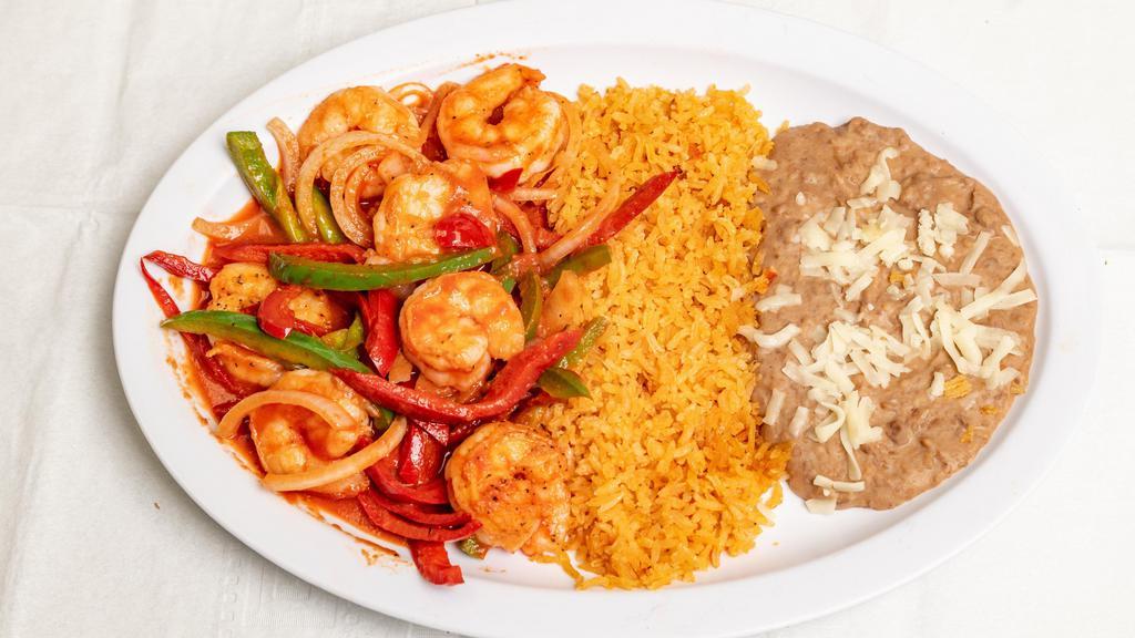 Camarones Rancheros · Shrimp cooked with onions, tomatoes, bell peppers, jalapeños, and ranchero salsa. Served with rice, beans, and salad.