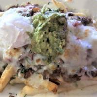 Asada Fries · Crispy French fries topped with chile colorado sauce, carne asada, onions, cilantro, jack ch...