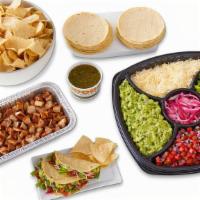 Taco Kit (Serves 10) · Build your own tacos with chicken, steak or pork and all the fixings for 10 people, includin...