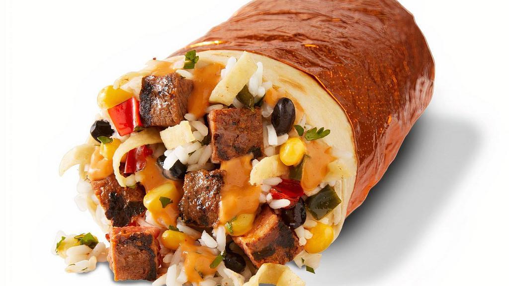 Southwest Steak Burrito · Grilled steak, chile crema, chile corn salsa, and crunchy tortilla strips with cilantro lime rice and black beans wrapped in a warm flour tortilla. [Cal 1060]. For additional ingredients or substitutions, please order a Create Your Own Entree.