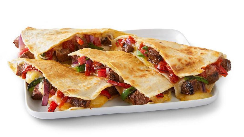 Steak Fajita Quesadilla · Grilled steak, grilled fajita veggies, pico de gallo, salsa roja and shredded 3-cheese blend grilled to perfection in a flour or whole wheat tortilla. Served with hand-crafted guac and sour cream. [Cal 1100]. For additional ingredients or substitutions, please order a Create Your Own Entree.