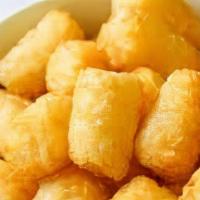 Tater Tots 24 Pcs · With their golden crispy outside and fluffy inside, TATER TOTS™ are as tasty as they are fun...