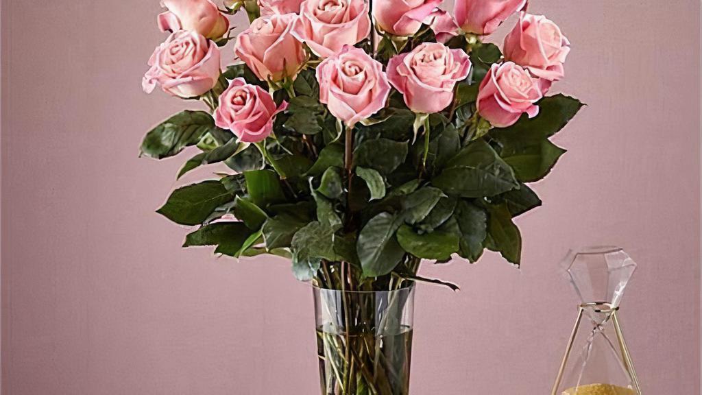 24 Long Stem Pink Roses · Enjoy the classic beauty of the rose with a playful twist in our Long Stem Pink Rose Bouquet. This arrangement features 24 pink roses that will look especially pretty in the hands of those you cherish most. Vase included. Item # E5440P