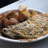 Vegetarian Omelette & Scrambler · Tomatoes, mushrooms, onions, bell pepper, spinach and cheddar jack cheese. Served with rice ...