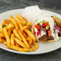 Gyros Pita · A combination of ground beef and lamb, perfectly seasoned, cooked in our rotisserie grill, a...