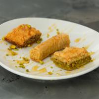 Baklava · An assortment of three traditional delicacies made with many layers of filo dough, lightly b...