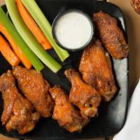 Wings (6) · Baked wings doused with choice of hot, bbq, jerk, or sweet chili sauce. Served with carrots ...