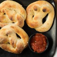 Pretzels (3) · Choose Salted or Parmesan.  Served with Ranch & Pizza Sauce