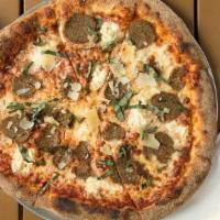 Capone Pizza · Red sauce, mozzarella, ricotta, meatball, fresh basil and shaved parmesan cheese after the b...