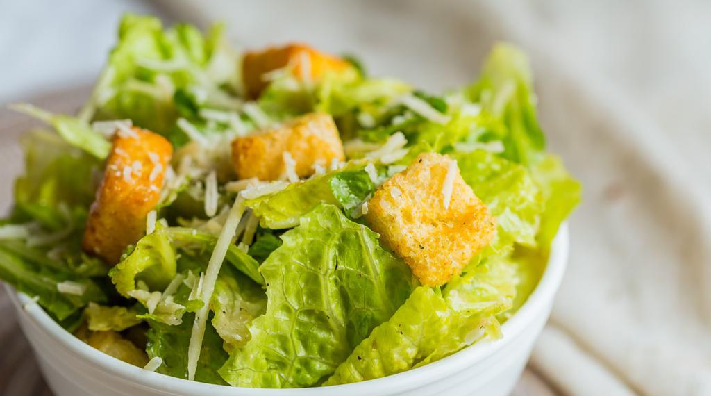 Caesar Salad · Top menu item. Vegetarian. Romaine, garlic croutons, Parmesan cheese, and house-crafted Caesar dressing.