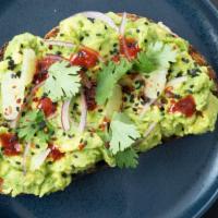 Avocado Toast · Smashed avocado, black sesame, gochujang. red onion, cilantro, lime, toasted sourdough. Vegan.