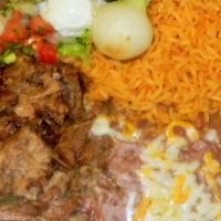 Carnitas Plate · Chunks of pork, fried then braised with our special coca cola recipe. Served with rice and b...