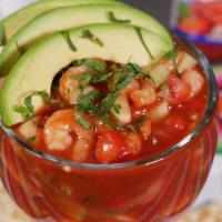 Shrimp Cocktail · Chilled shrimp in a tomato sauce with cucumber, onion, tomatoes, avocado, and cilantro. Serv...