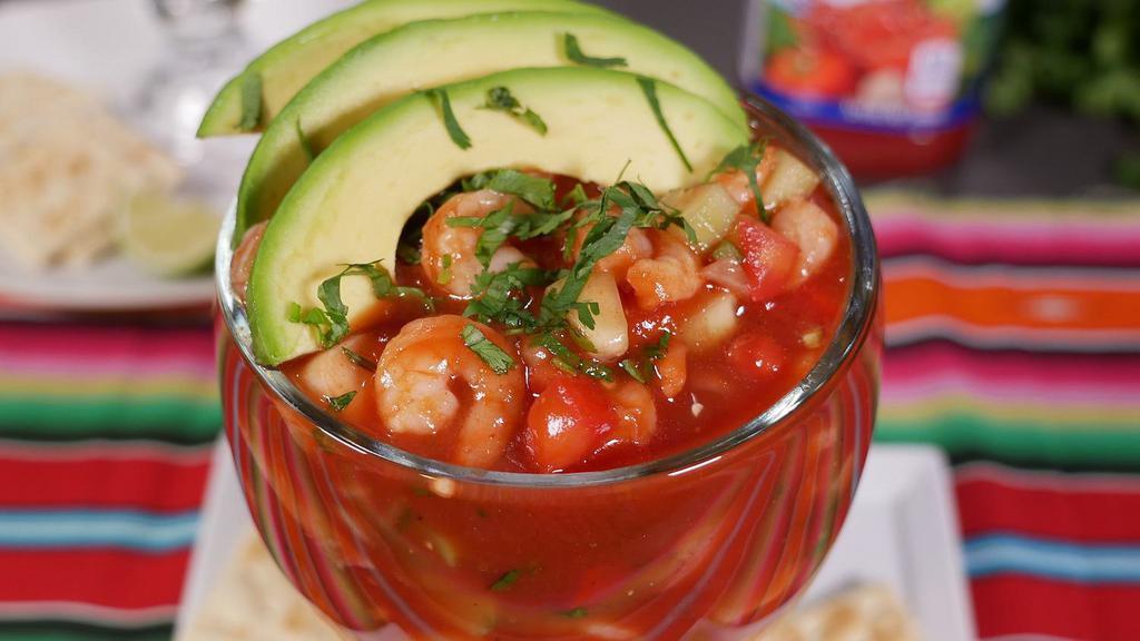 Shrimp Cocktail · Chilled shrimp in a tomato sauce with cucumber, onion, tomatoes, avocado, and cilantro. Serve cold with saltine crackers.
