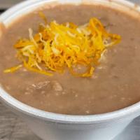 1/2 Pint Beans  · Refried beans topped with a little cheese