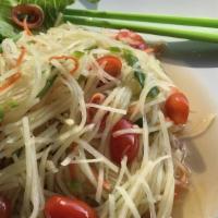 Papaya Salad · Strings of young green  papaya (hand sliced) tossed in  sweet tamarind garlic lime juice, to...