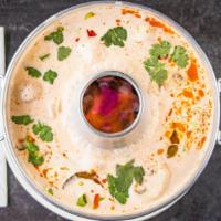 Tom Kha · Spicy and sour coconut soup.